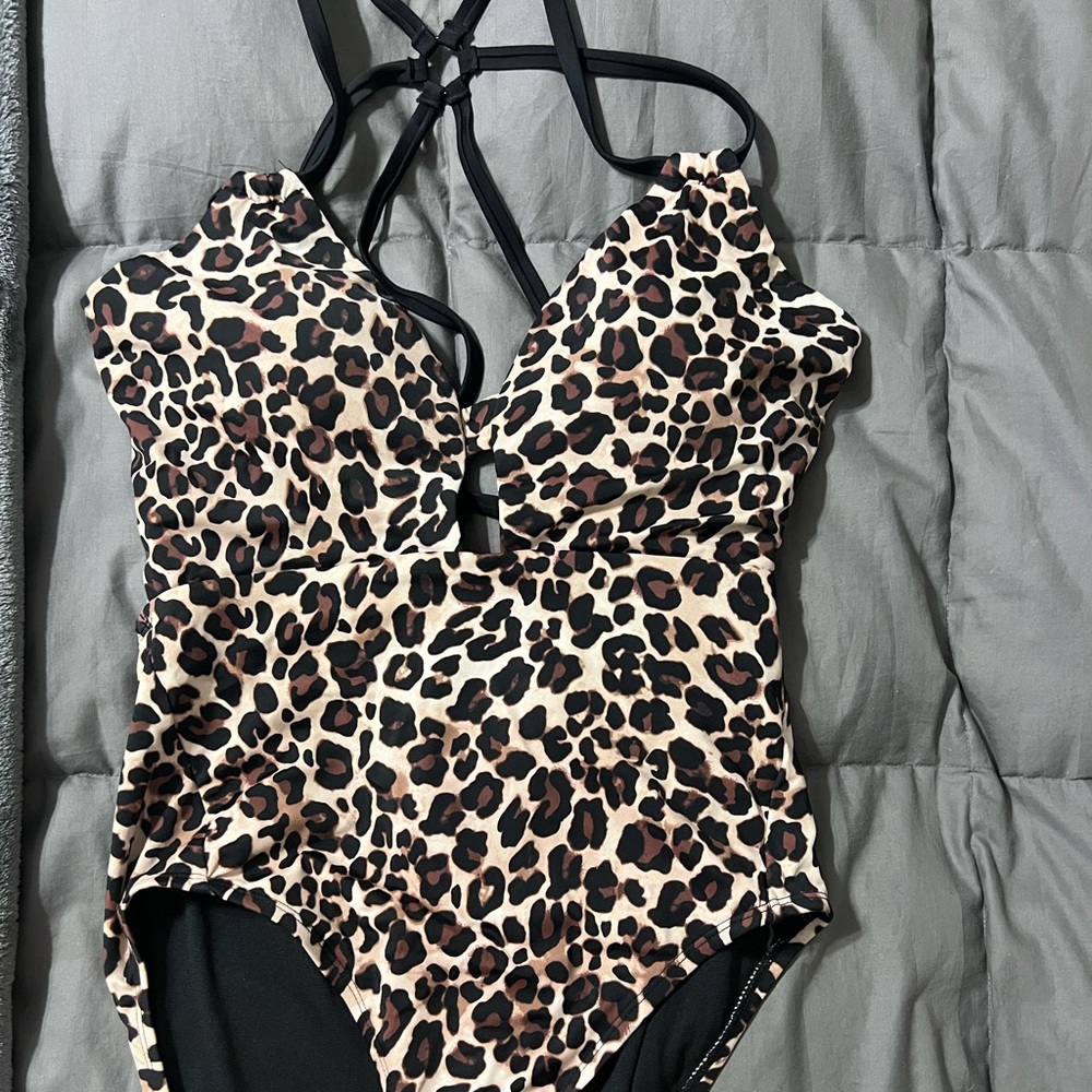One piece swim suit. Cheetah print. Size 12-14.